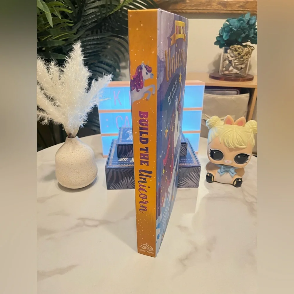 Build the Unicorn Kids Building Set, reading book, and Lear